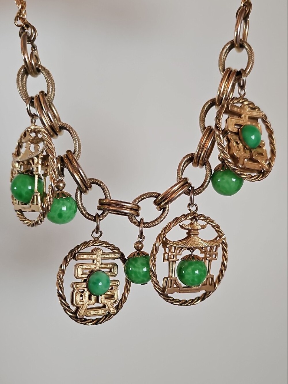 Gold-Tone Statement Necklace with Green Stone Charms
